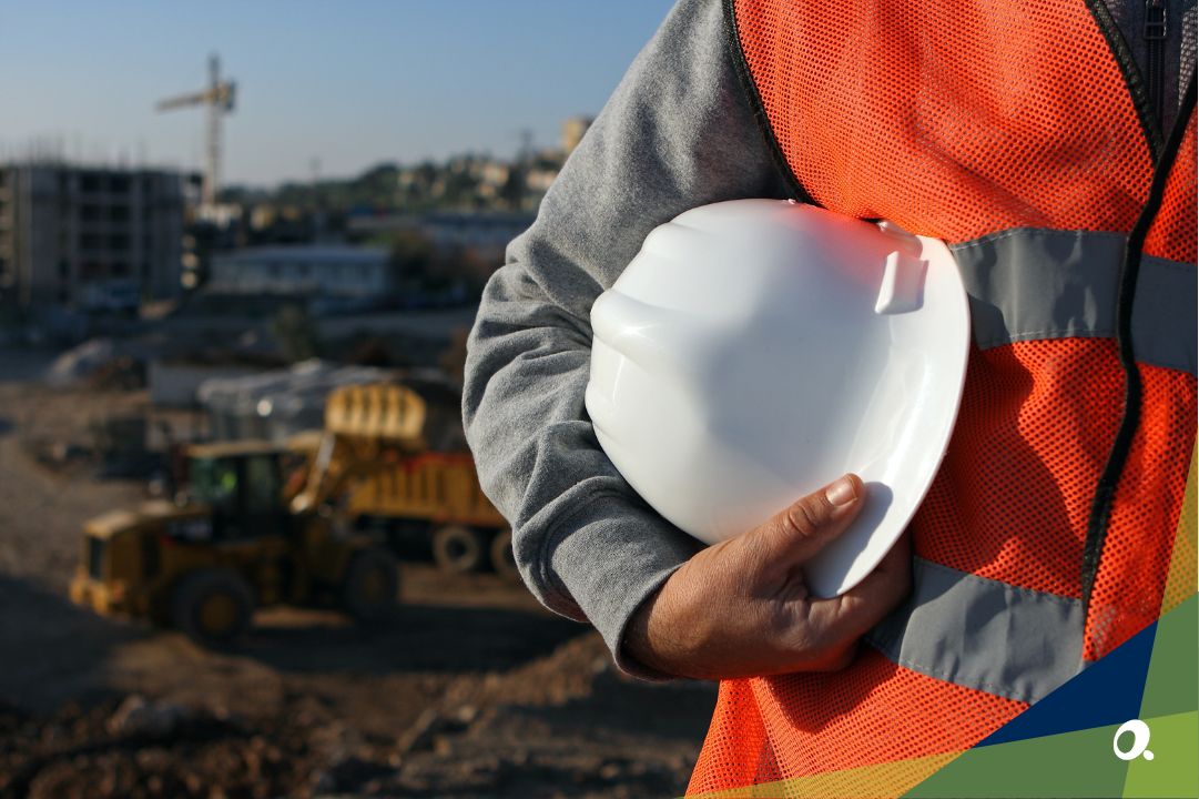 Construction worker holding construction hat