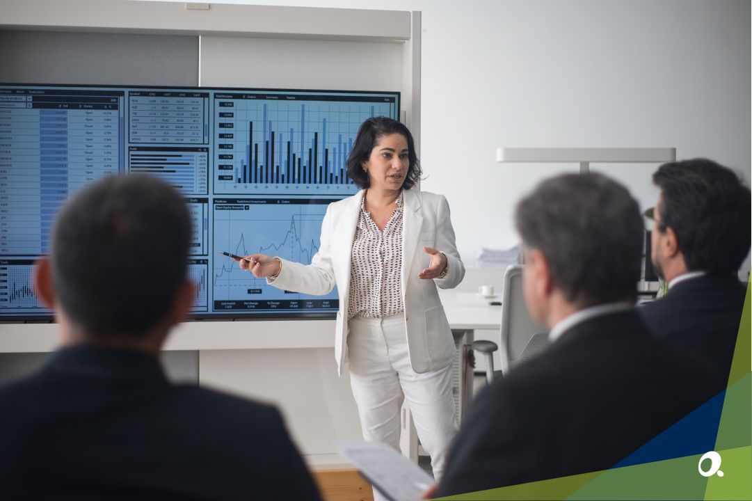 A professional discussing finance strategies in a modern office setting.