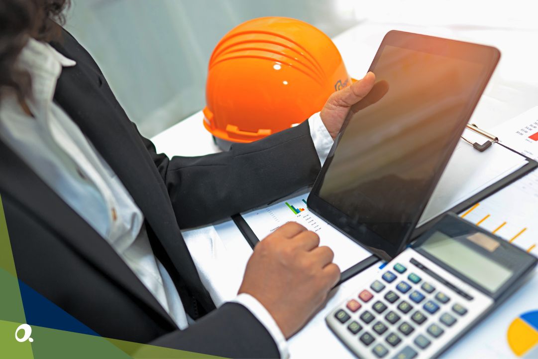 Finance professional in construction industry holding a tablet