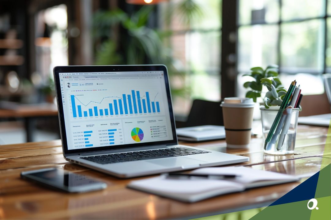 Laptop on a desk with a financial dashboard