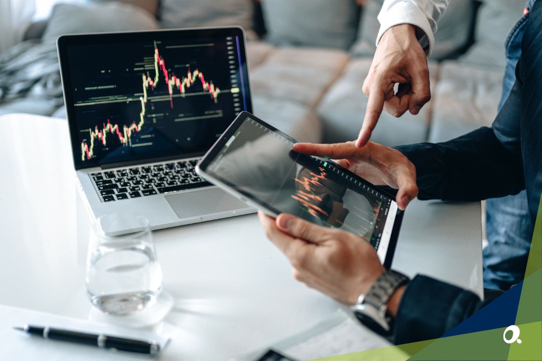 Close-up of a business leader reviewing financial reports on a laptop.