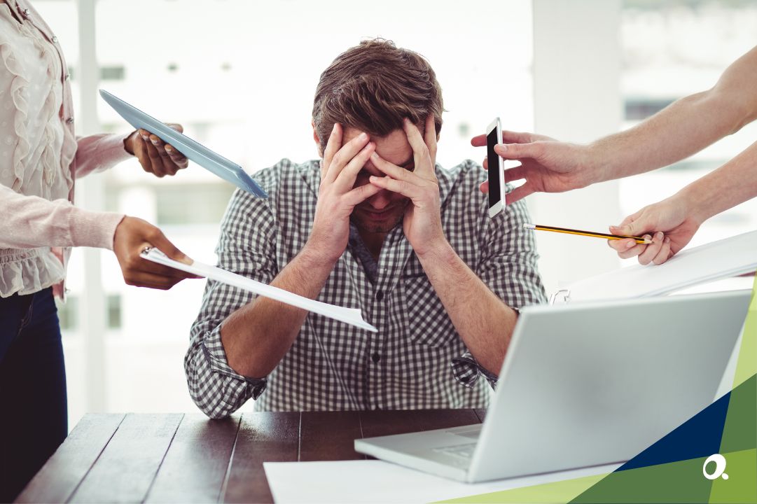 A team in a conference room, visibly stressed as they discuss data from a financial presentation.