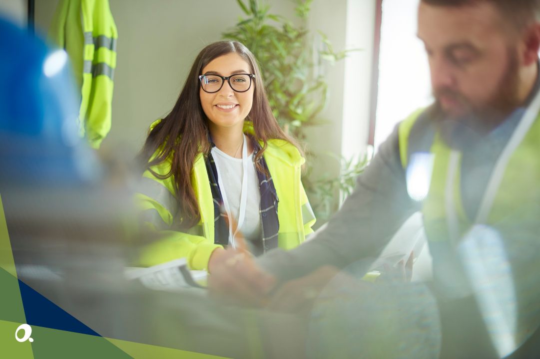 Female construction professional smiling at the camera