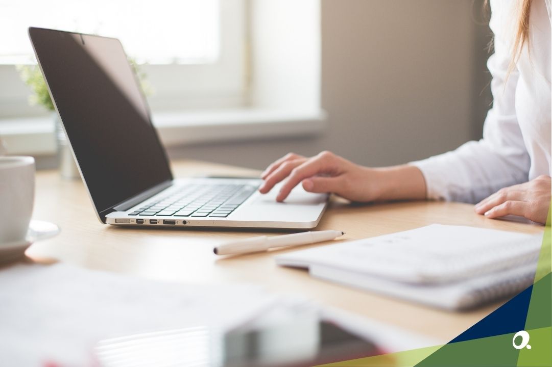 Close-up of a person working on Sage Intacct software on a laptop