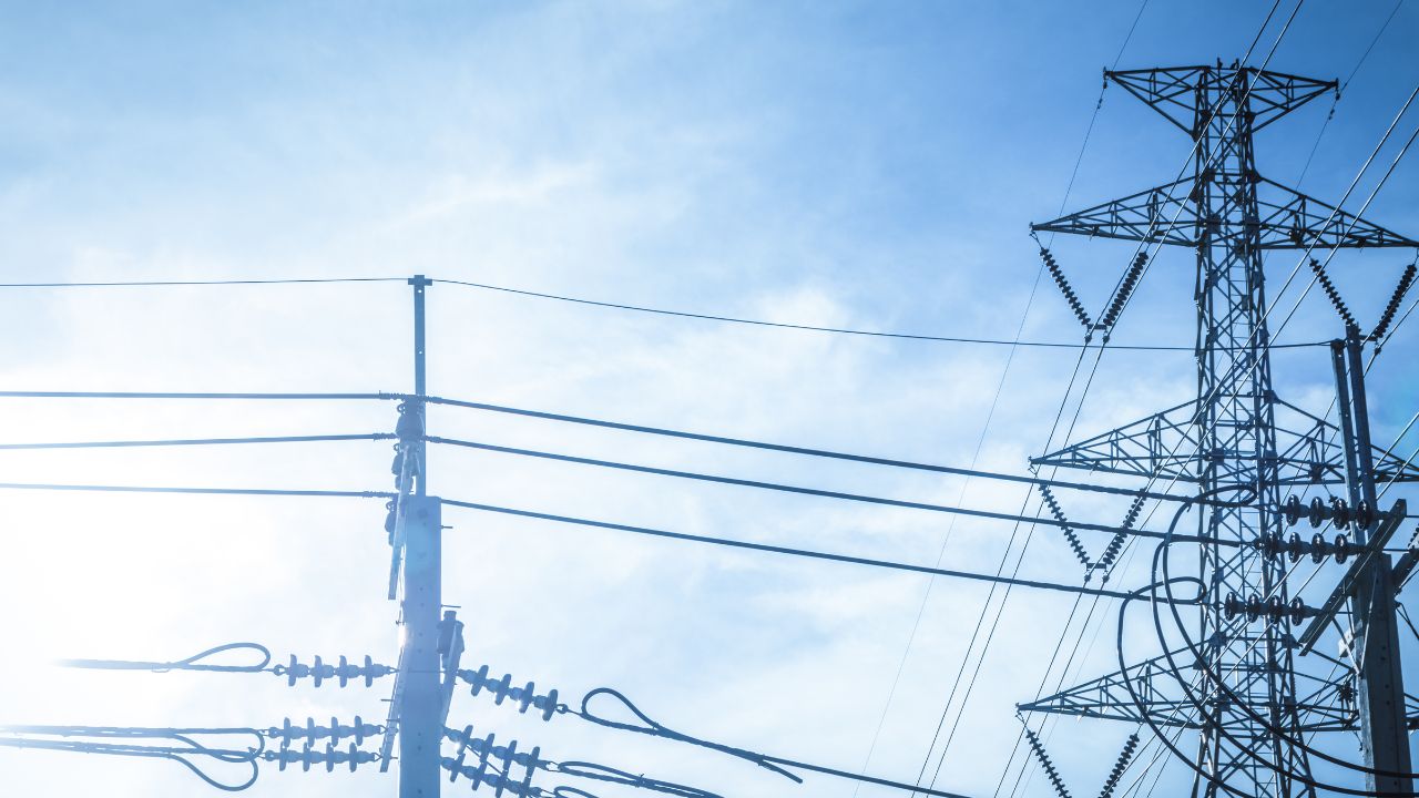 An electricity grid with a blue sky in the background