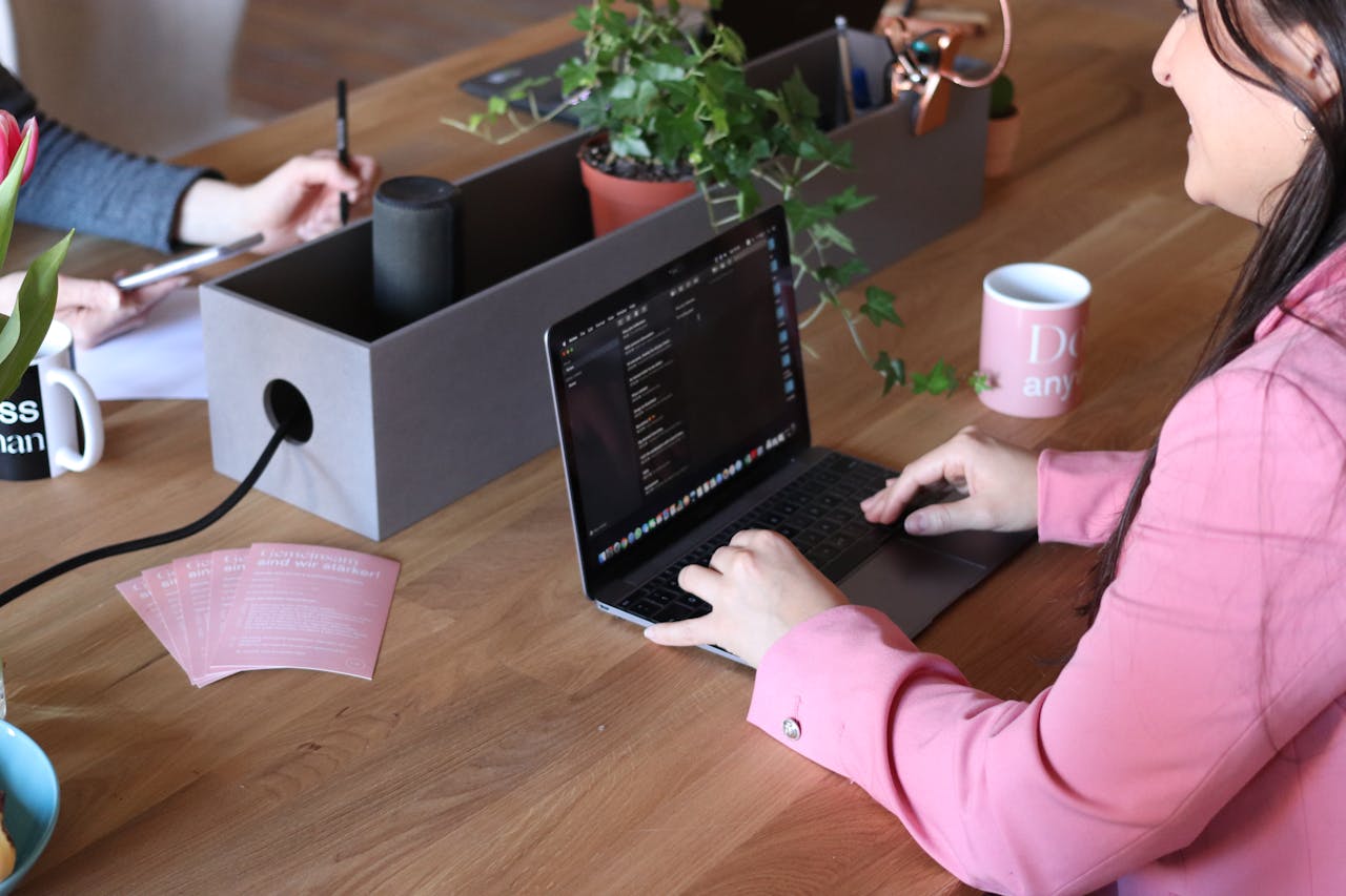 Woman working on her laptop at a desk