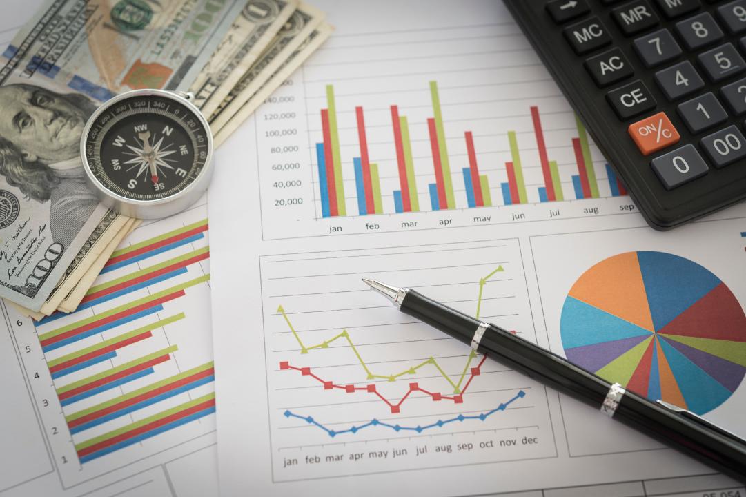 Financial forecast papers on a desk